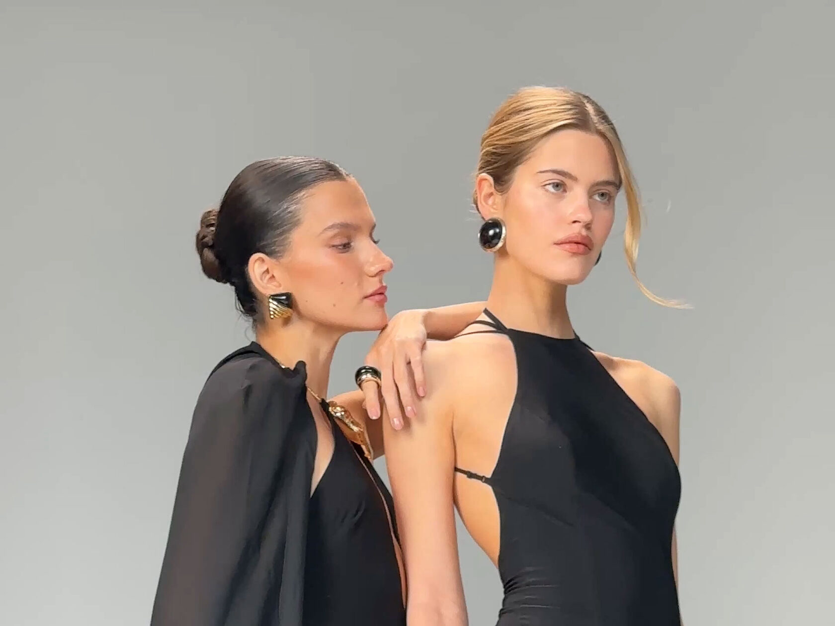 THE U fashion campaign with two models wearing black